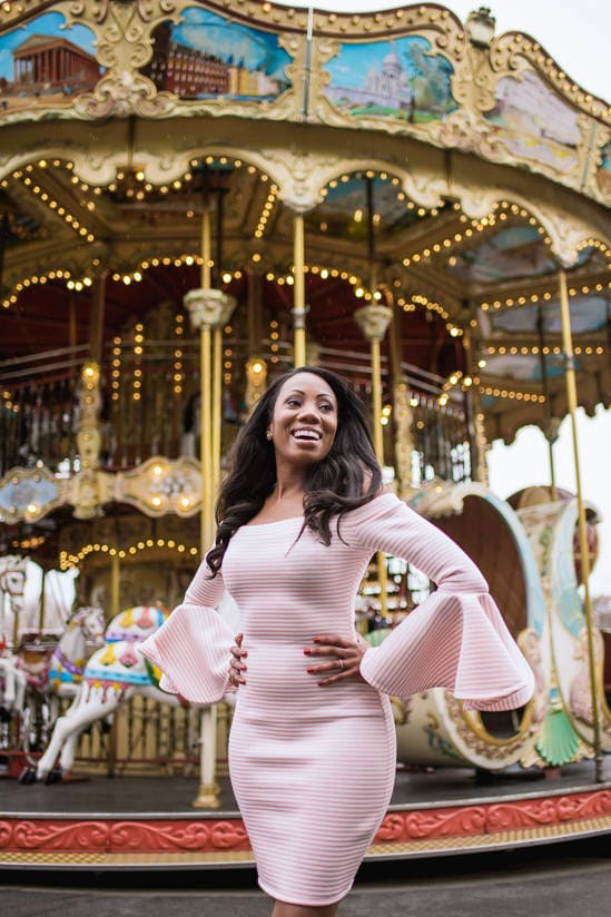 Beautiful black girl dressed in pink smiling in Paris Beautiful black girl dressed in pink smiling in Paris