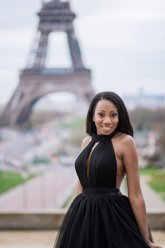 Beautiful girl posing in front of the Eiffel Tower in her black tulle dress Beautiful girl posing in front of the Eiffel Tower in her black tulle dress