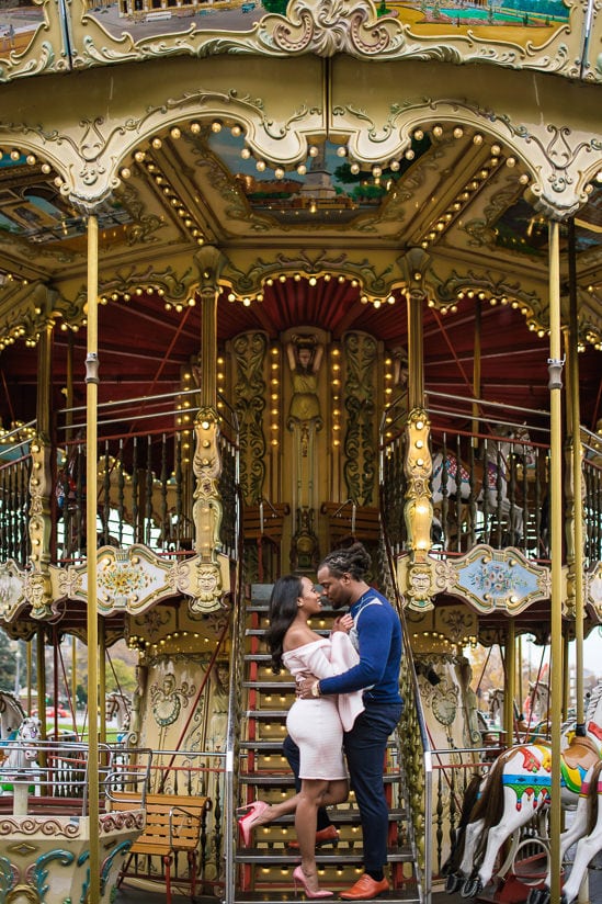 Cute couple photo shoot on the merry go round near the Eiffel Tower in Paris Cute couple photo shoot on the merry go round near the Eiffel Tower in Paris