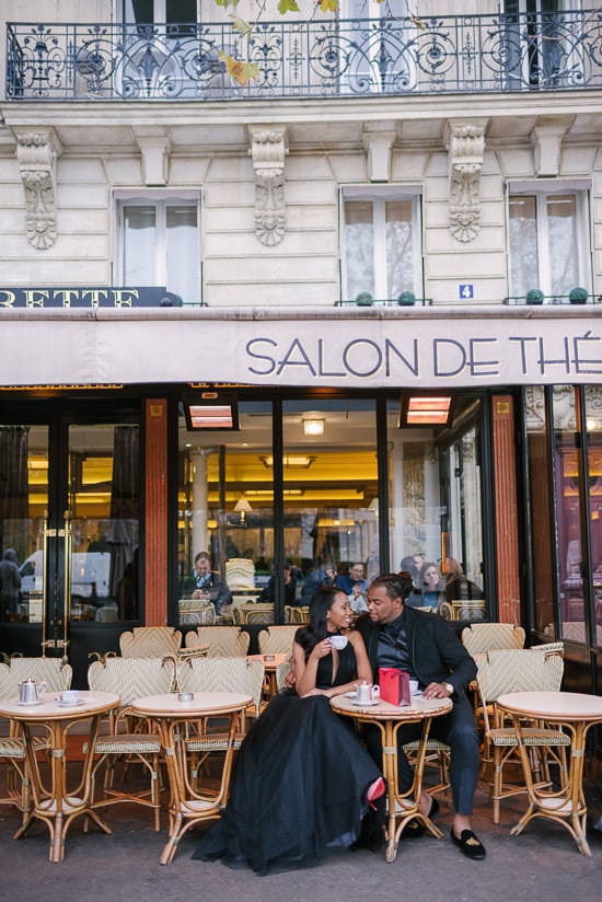 Cute couple photoshoot in a parisian café. Sharing macarons and hot chocolate at Carette Paris in Place de Trocadéro Cute couple photoshoot in a parisian café. Sharing macarons and hot chocolate at Carette Paris in Place de Trocadéro