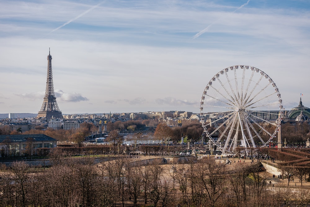 The view over the city of Paris from Le Meurice hotel - Eiffel Tower and the Ferris Wheel The view over the city of Paris from Le Meurice hotel - Eiffel Tower and the Ferris Wheel
