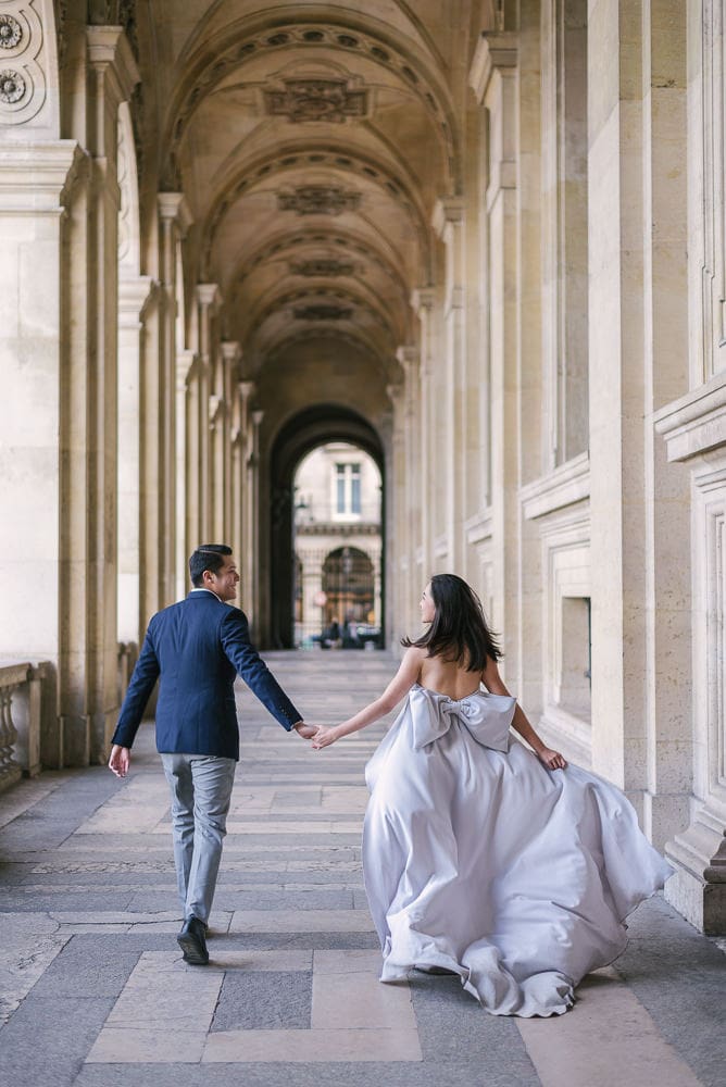 Paris pre wedding photography - The running away pose Paris pre wedding photography - The running away pose