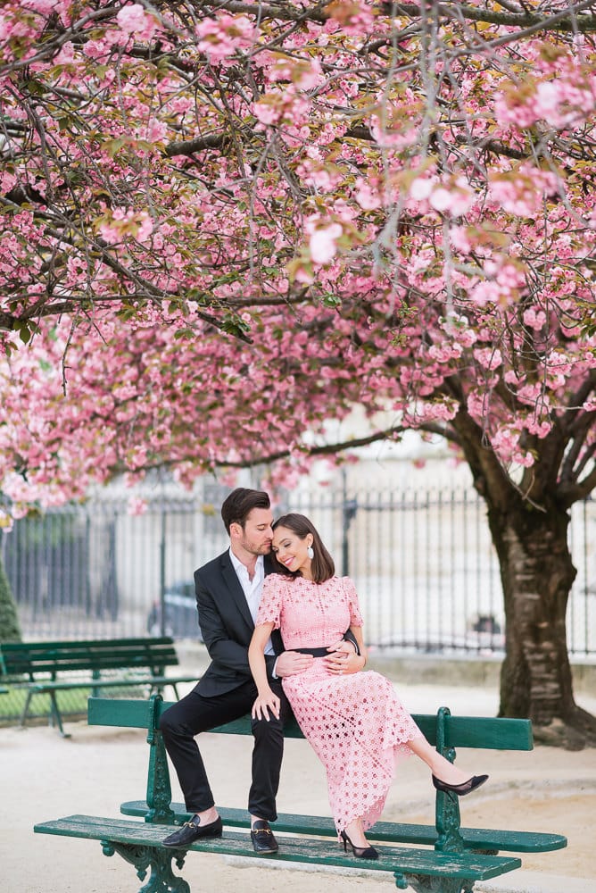 Spring engagement photos - Beautiful latina girl kissing her fiancé under a cherry blossom in Paris 2 Spring engagement photos in Paris - Beautiful latina girl kissing her fiancé under a cherry blossom in Paris 2