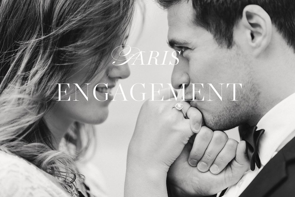 paris engagement - young man kissing his fiancée on the hand showing engagement ring paris engagement - young man kissing his fiancée on the hand showing engagement ring
