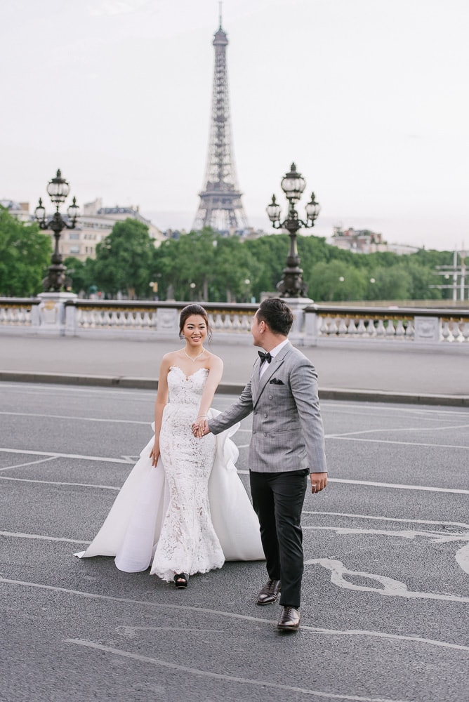 pre wedding pictures poses - bride and groom crossing the street in Paris -full pre wedding pictures poses - bride and groom crossing the street in Paris -full