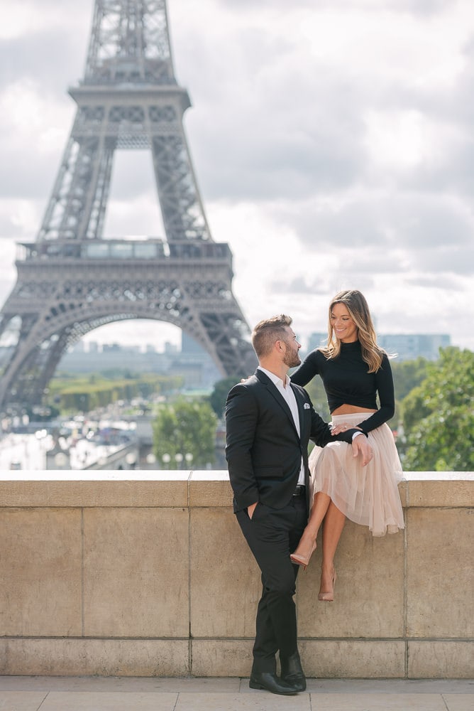 Paris photography - romantic picture of a couple in love at the Eiffel Tower in Paris, France Paris photography - romantic picture of a couple in love at the Eiffel Tower in Paris, France